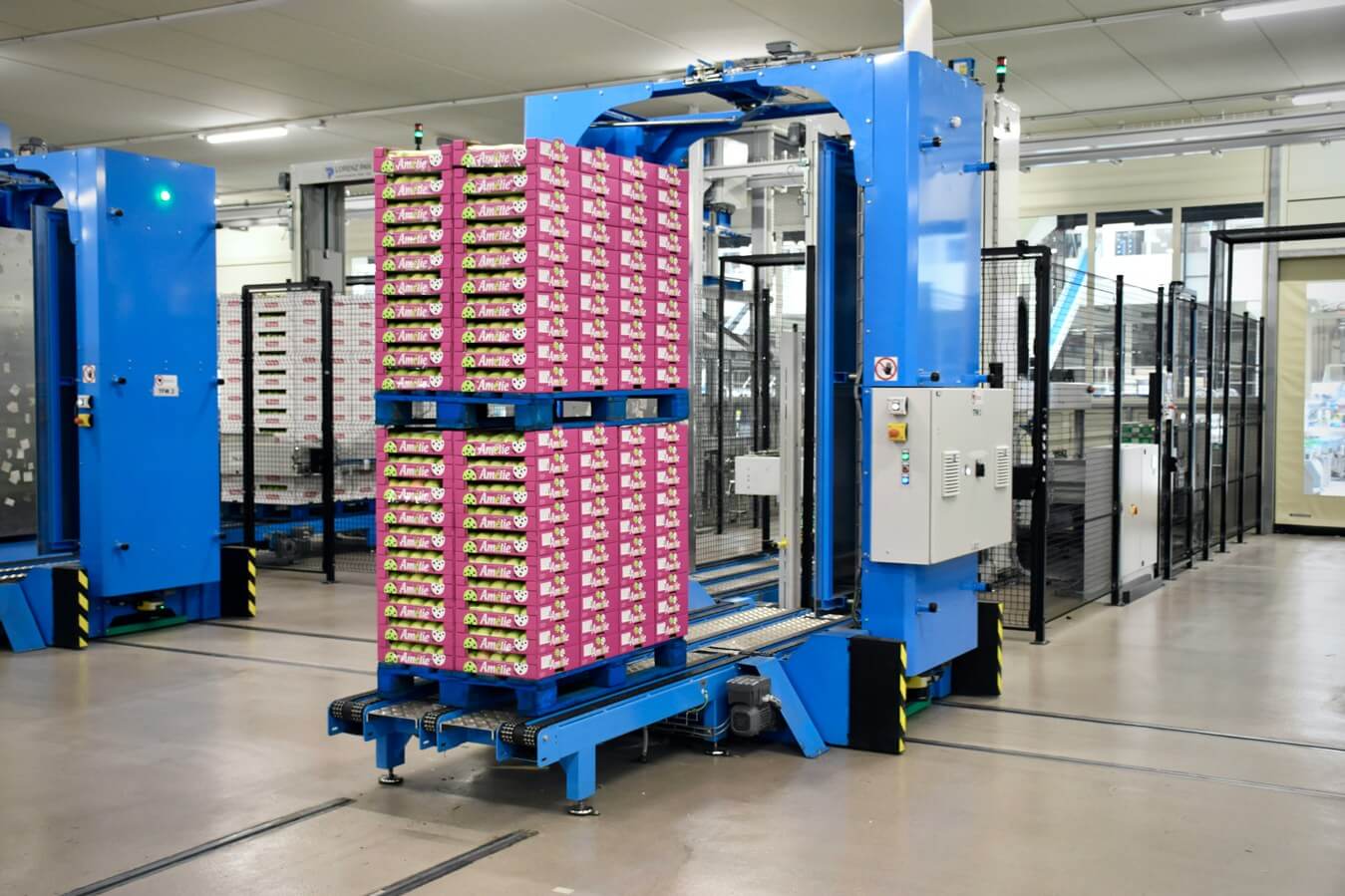 Completed retail pallet being automatically strapped before dispatch